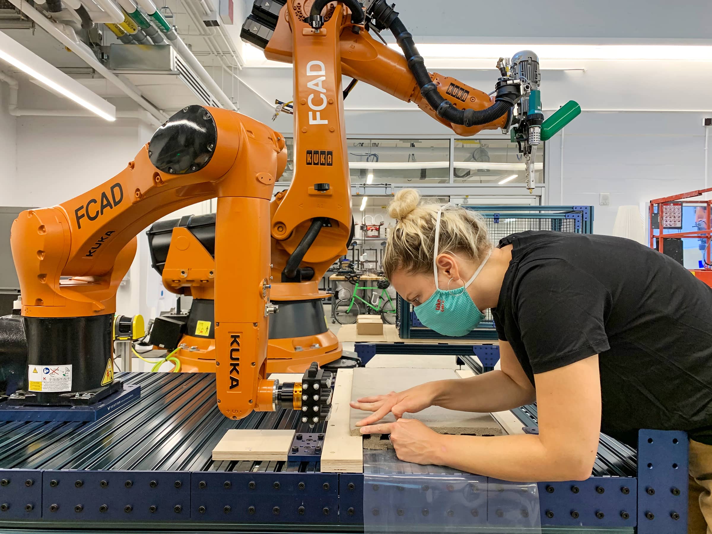 A researcher works on the project using the robot in the Creative Technology Lab.