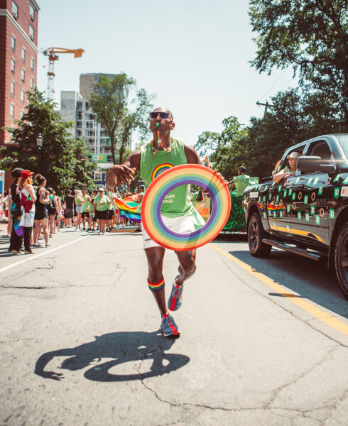 Al Ramsay running in the Toronto Pride Parade.