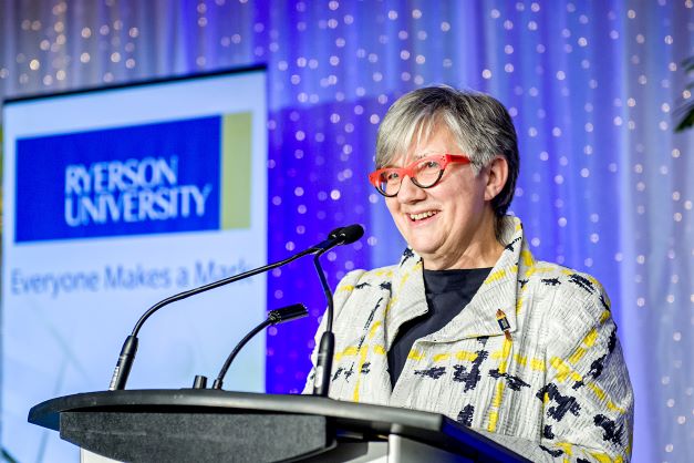 Carla Cassidy speaking at a podium.