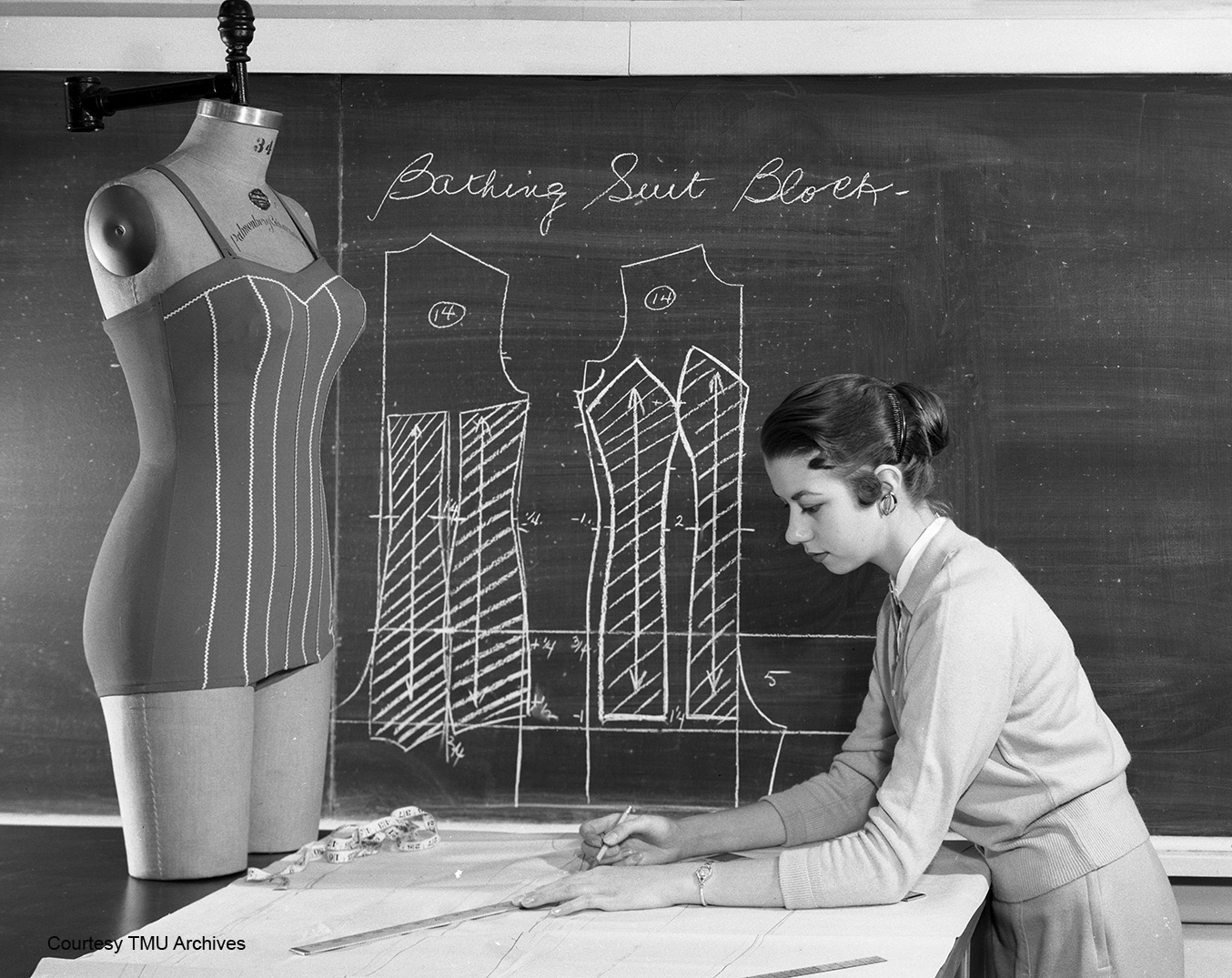 Alumna Lynn Grant, Fashion ’57, with a bathing suit block in 1957.