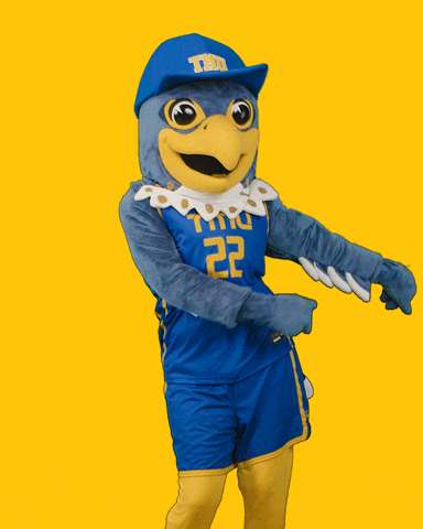 A university mascot dressed as a falcon, dancing.