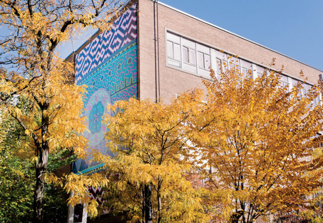 A mural on Kerr Hall West is pictured. It is meant to unify the traditions and cultural legacies of the Arctic and Amazon region, as well as honour global Indigeneity.