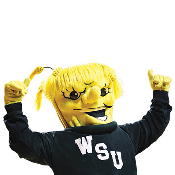 A university mascot dressed in black athletic gear and a yellow face resembling a wheat stalk.
