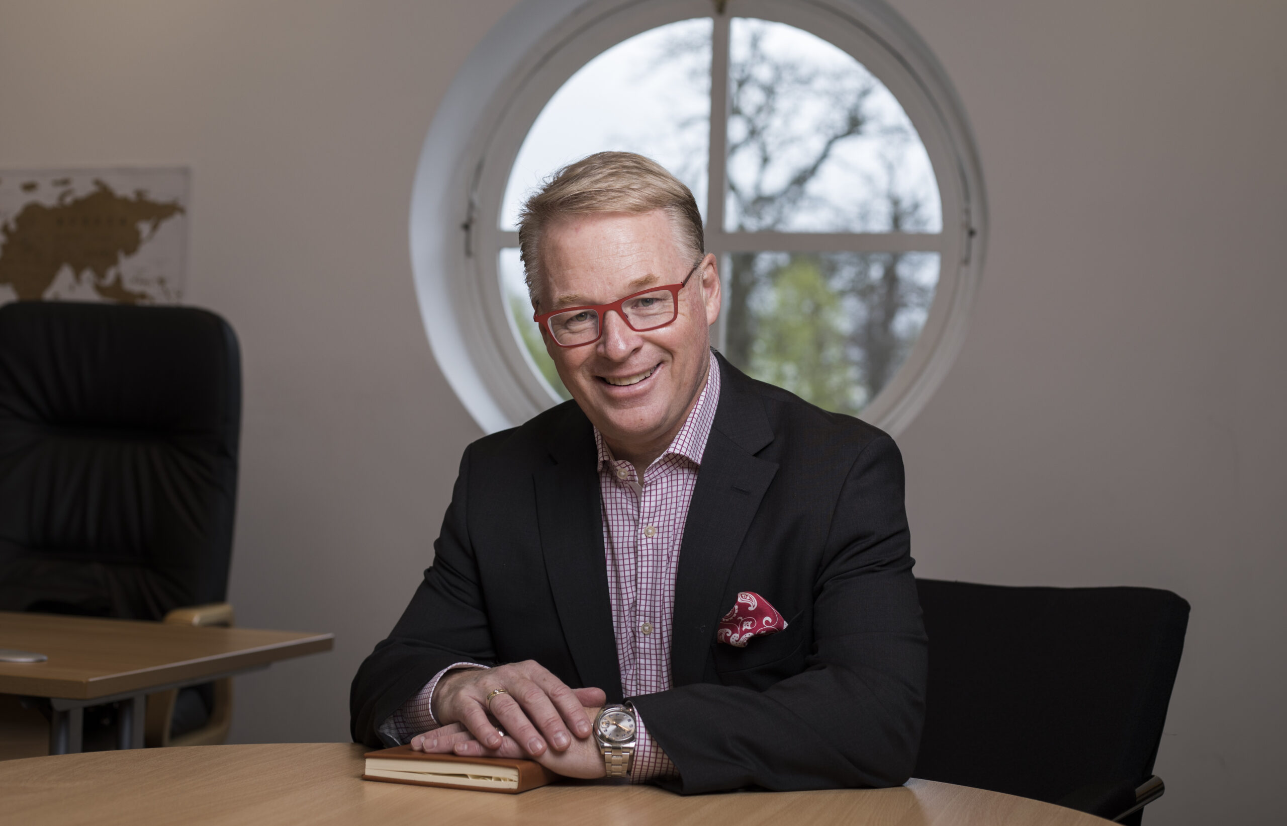 Keith Pelley sitting at a desk.