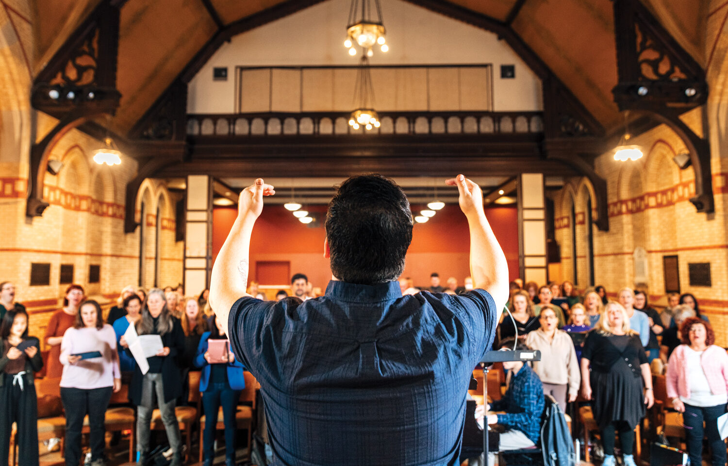 A person conducts a choir.