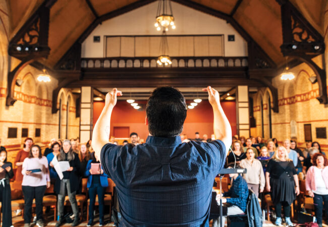 A person conducts a choir.