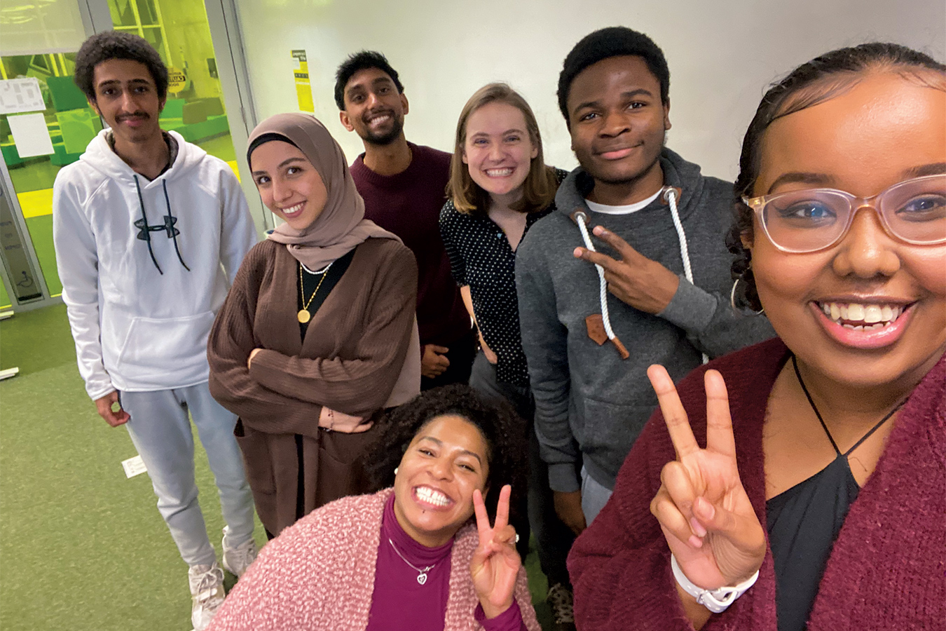 Young students from diverse background pose for a picture