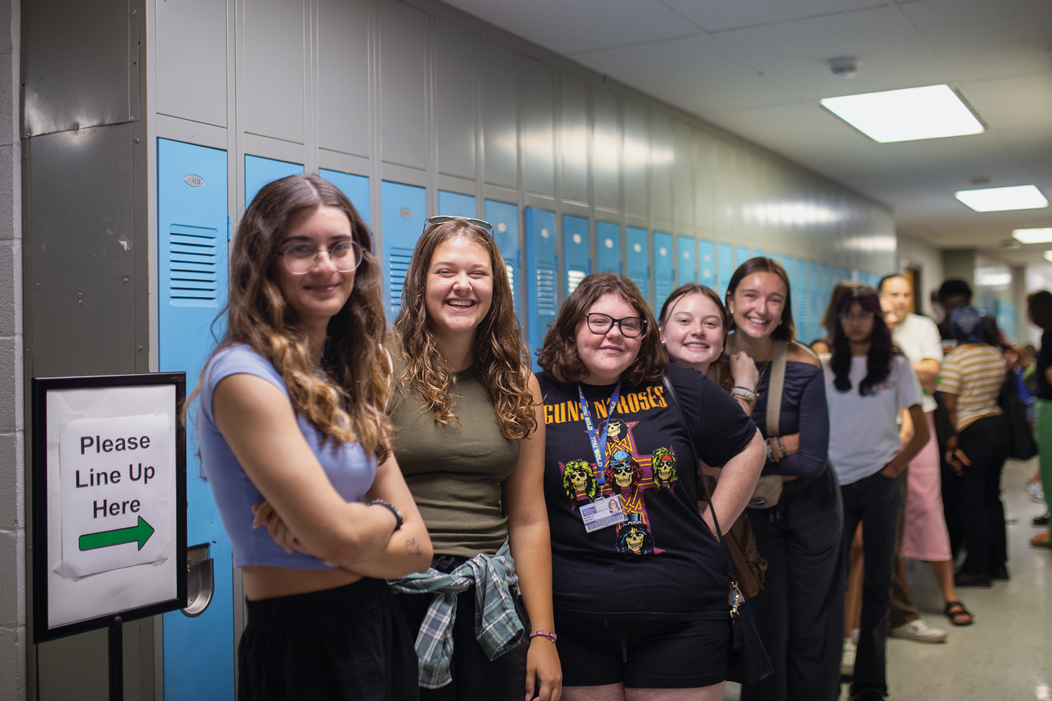 Smiling students lined up to go to the Free Store.