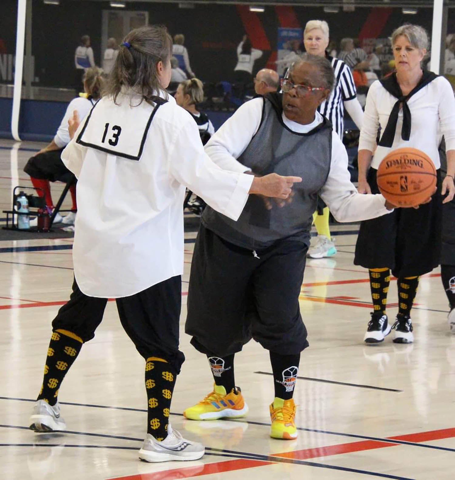 Women on the basketball court together.