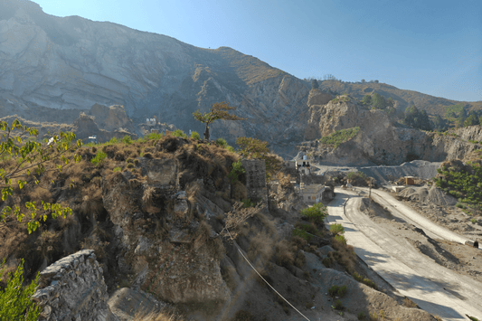 A mountain range that has been damaged by illegal mining in Pakistan is in view.