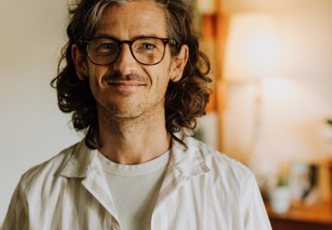 Alt text: James Cairns smiling.