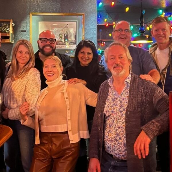 A group of people smiling for the camera.