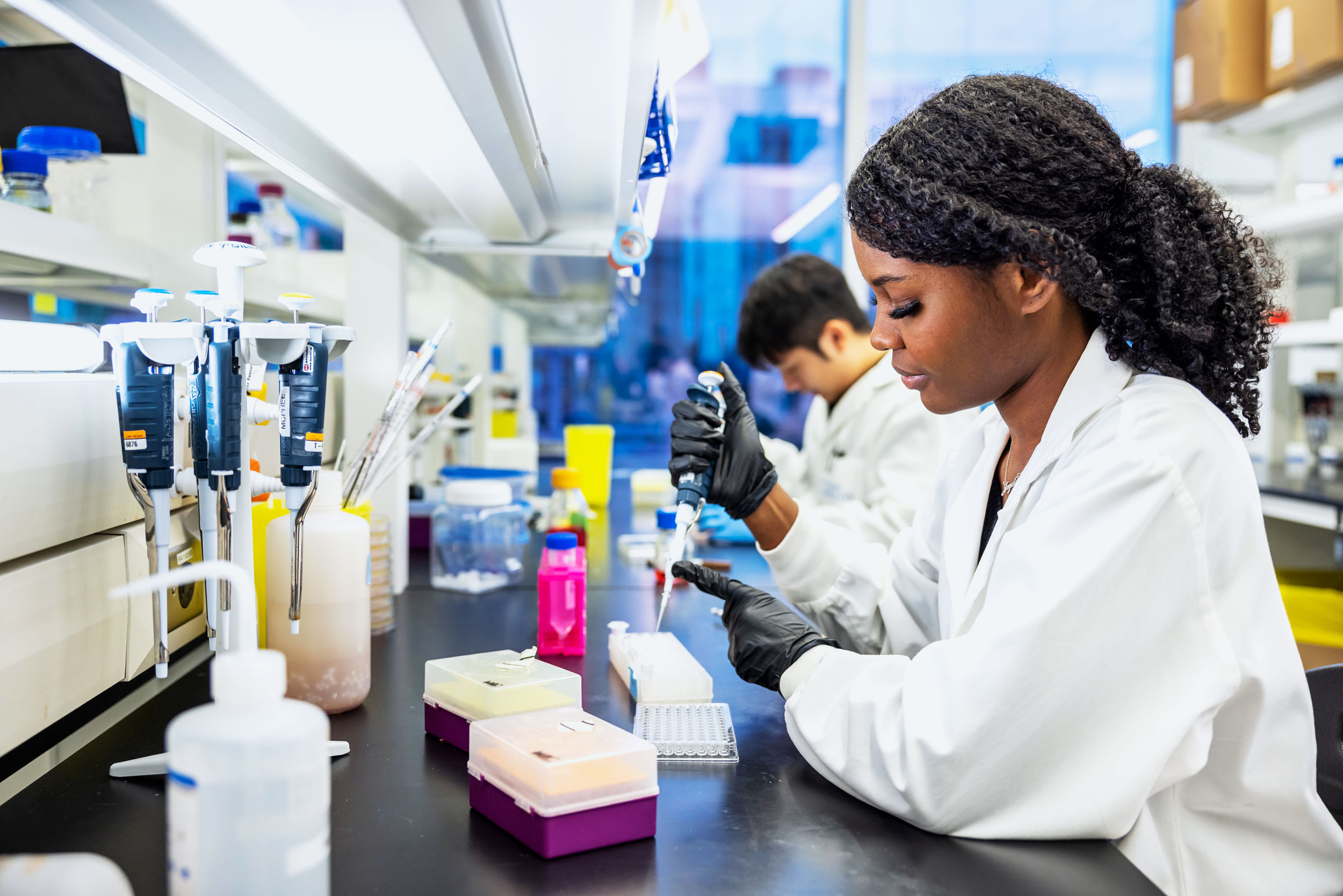 Someone conducting research in a lab.
