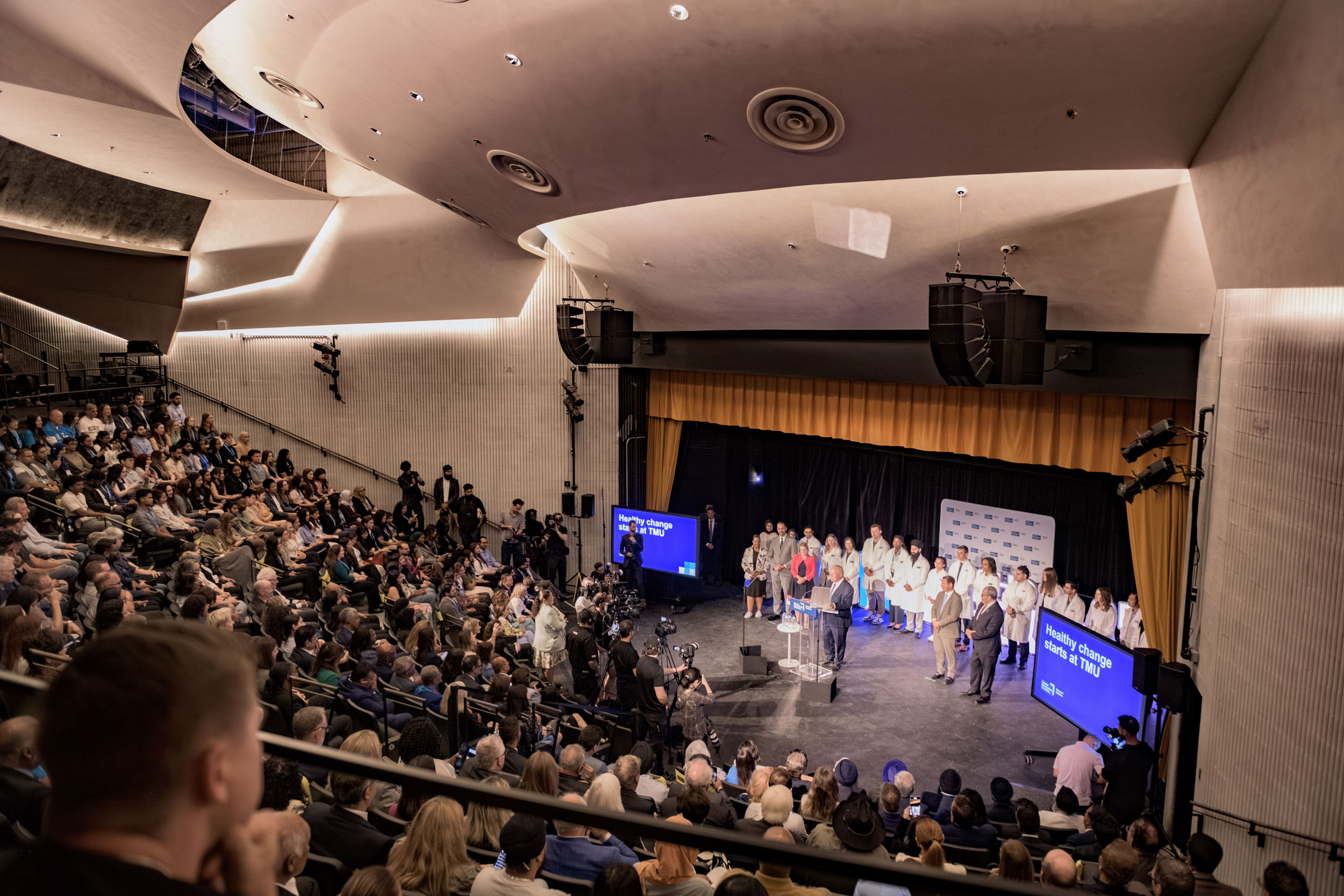 An auditorium full of people at TMU's School of Medicine launch.