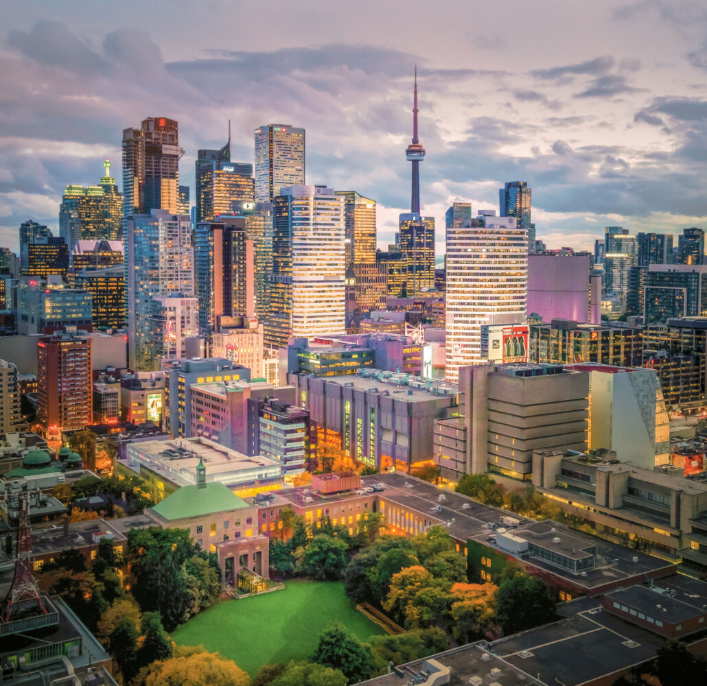 Aerial view of downtown Toronto at dusk, with the TMU campus and surrounding city buildings visible.