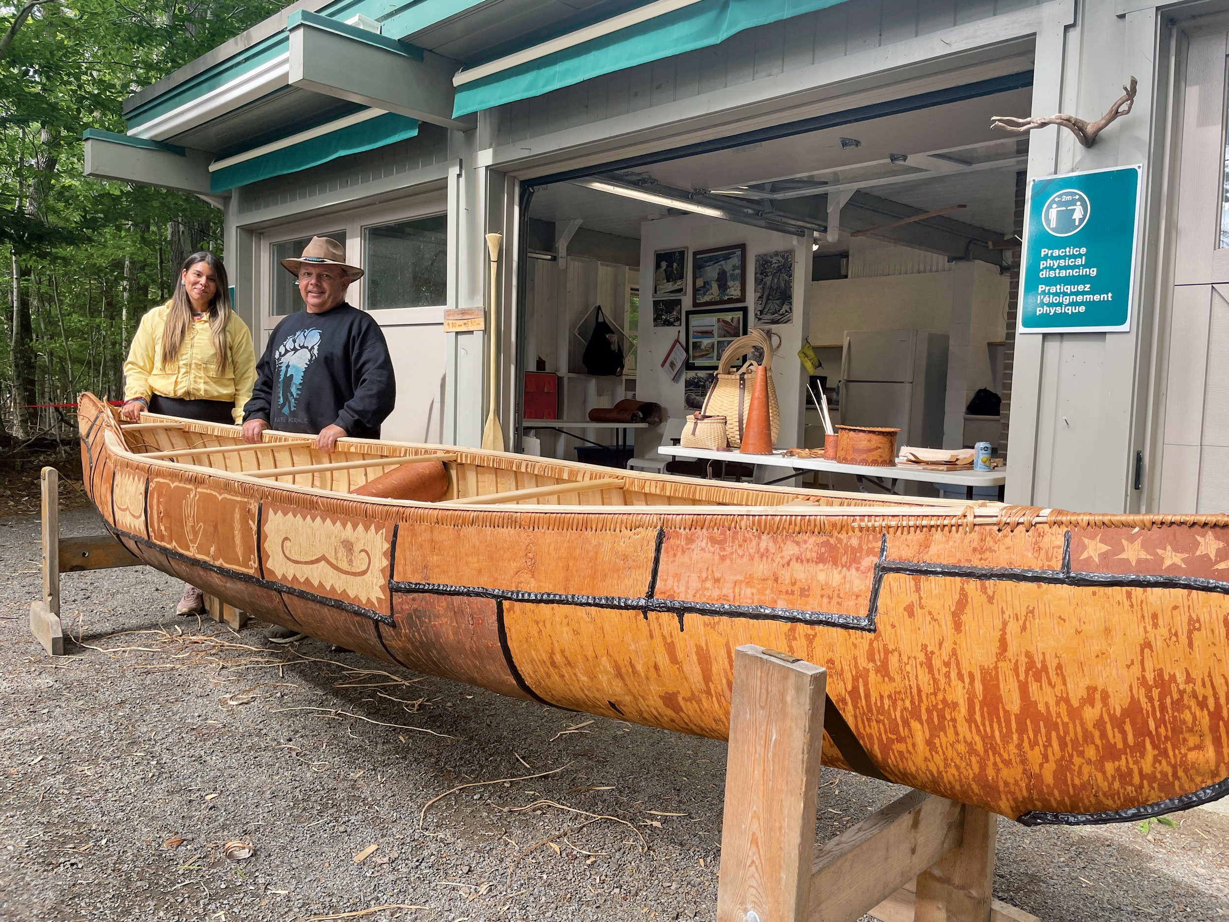 Todd Labrador standing outside with his canoe.